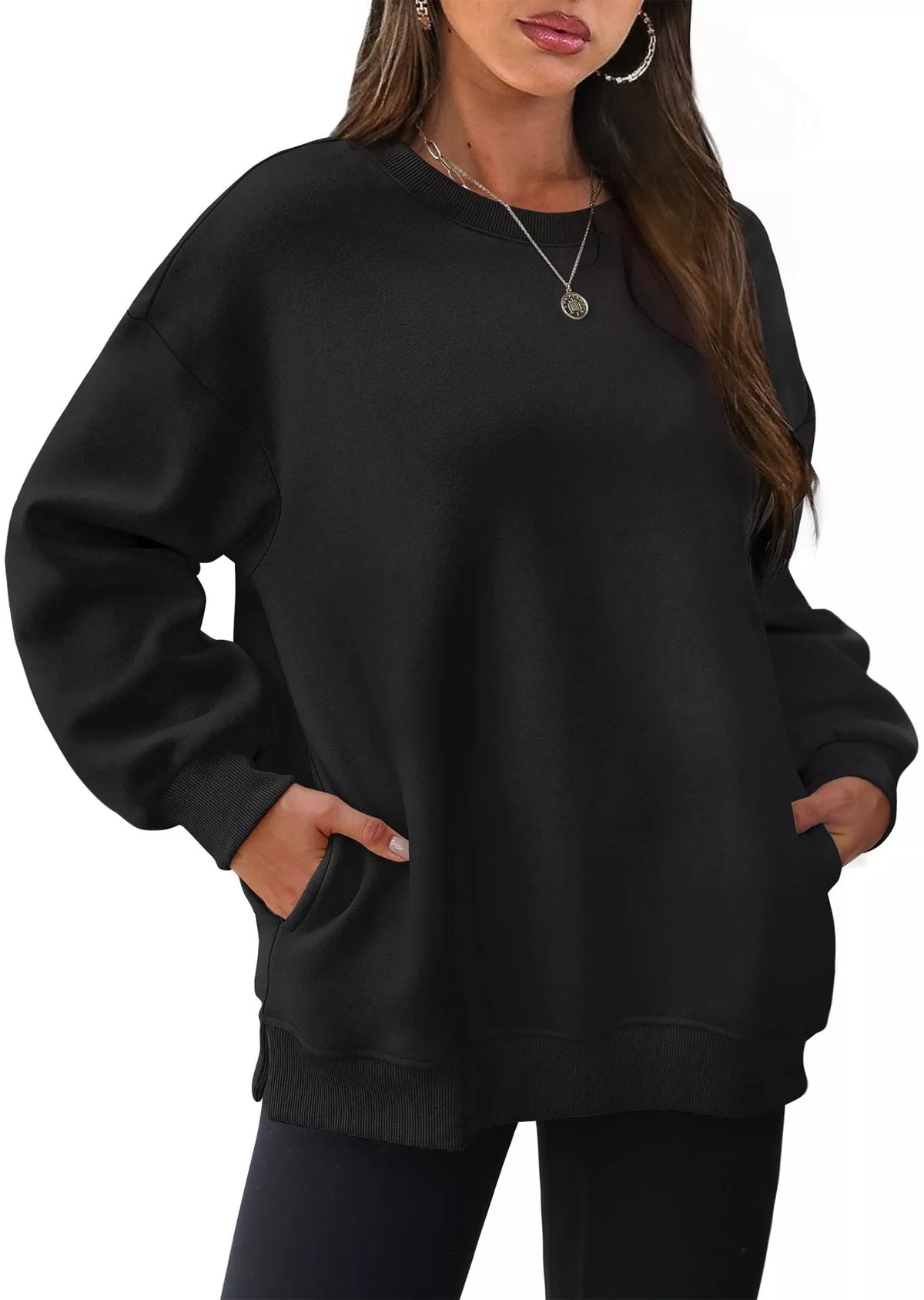 Black long sleeve casual sweatshirt with crew neckline and front pockets worn by woman.
