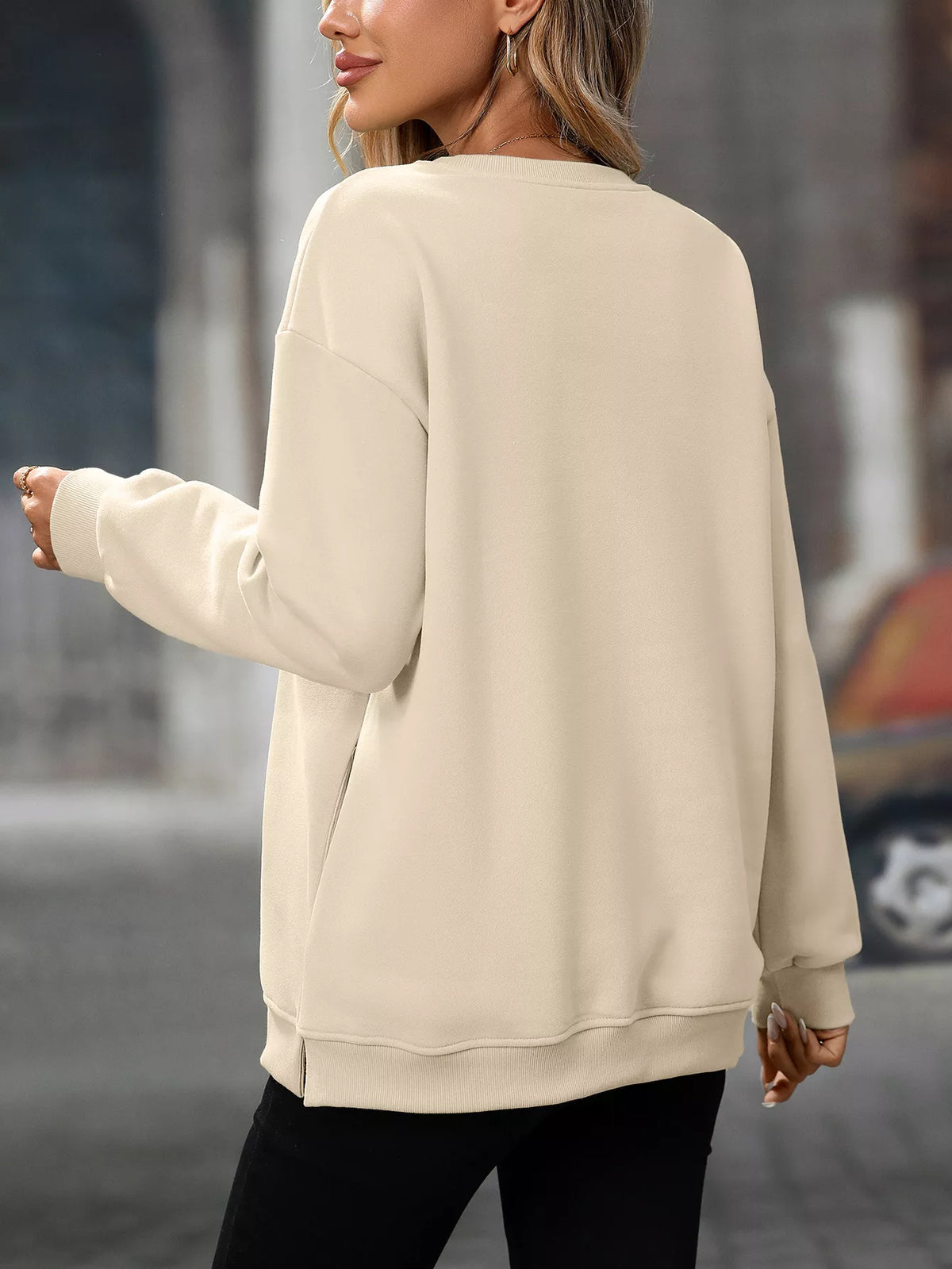 Beige casual solid color long sleeve sweatshirt with a relaxed fit and ribbed cuffs and hem.