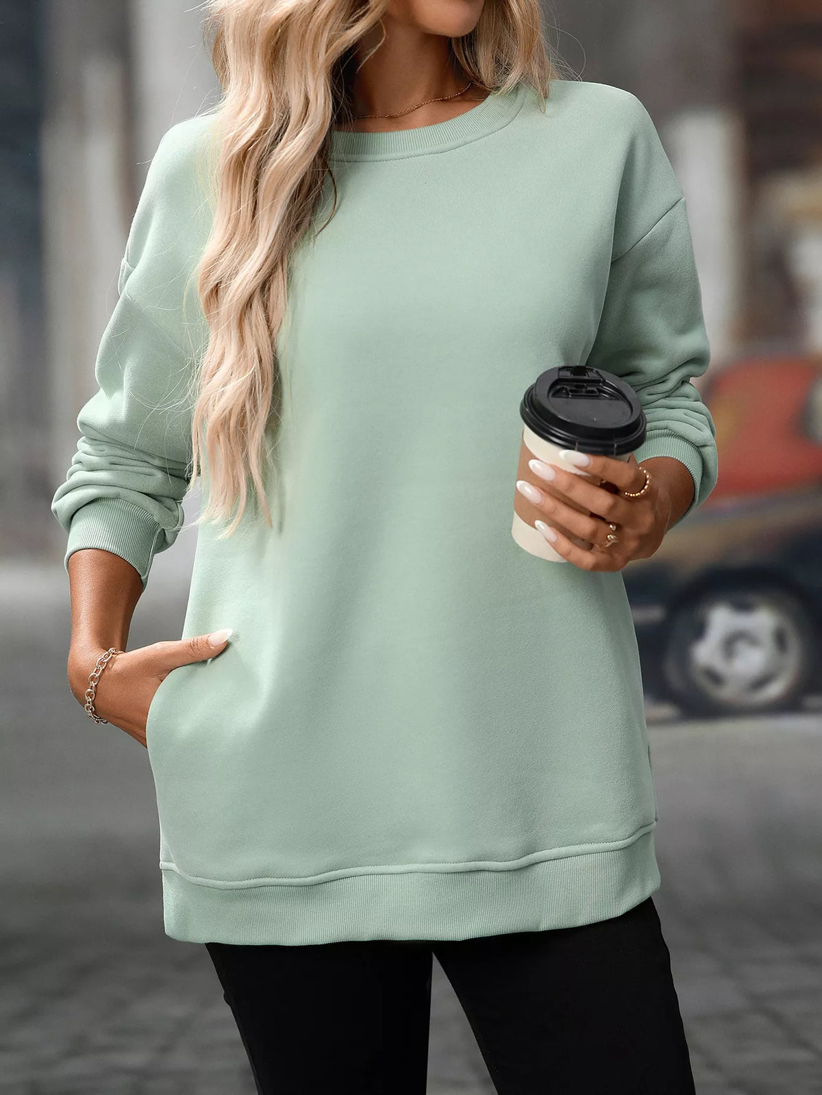 Casual gum leaf green long sleeve sweatshirt with crew neck and relaxed fit.
